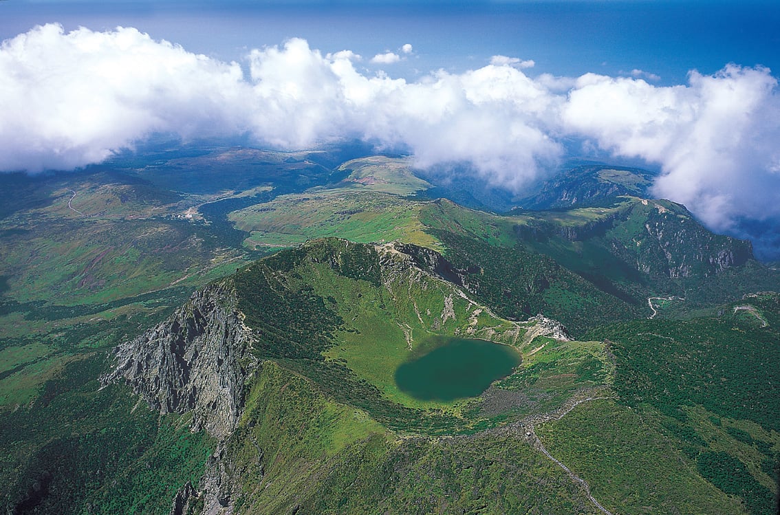 Hallasan National Park hiking trail through volcanic forest toward crater Jeju Island South Korea